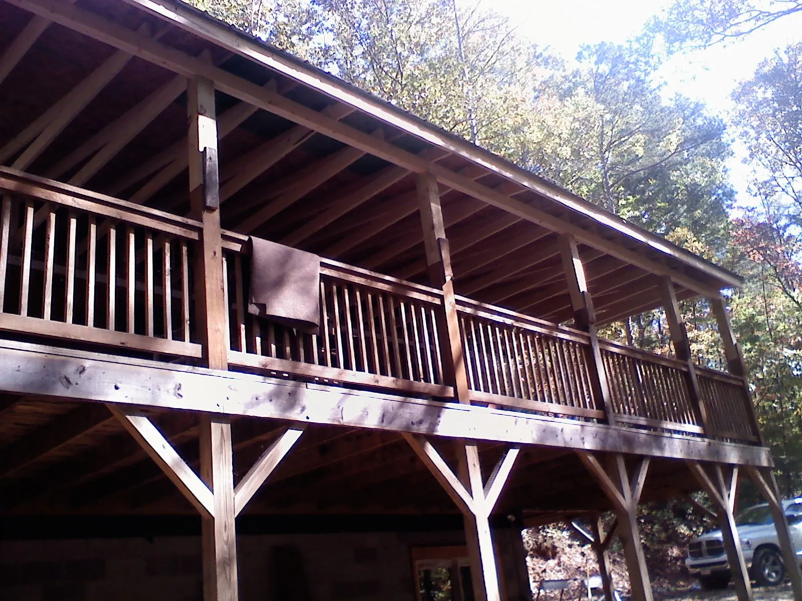 Timber framing under a new elevated porch and deck — Roof Leak Repair in Lowell by Roofing Brothers